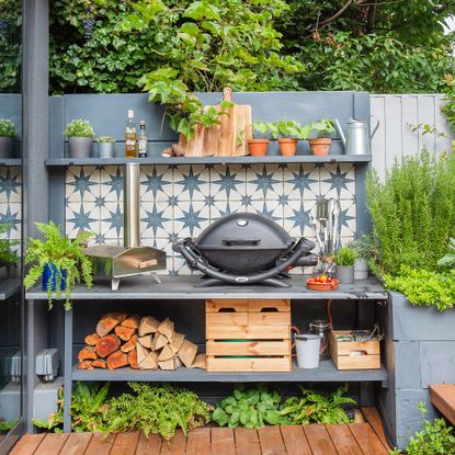 Outdoor kitchen with BBQ and pizza oven