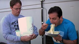 Dwight watching Michael eat pasta before a race