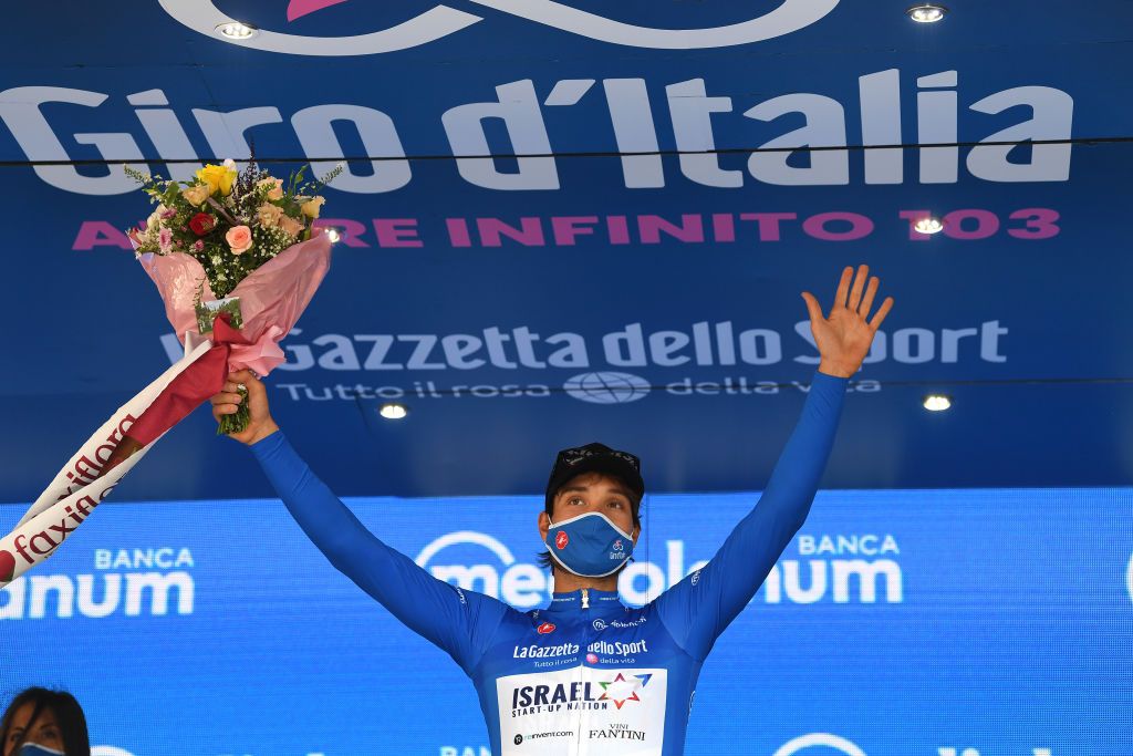 PALERMO ITALY OCTOBER 03 Podium Rick Zabel of Germany and Team Israel StartUp Nation Blue Mountain Jersey Celebration Mask Flowers during the 103rd Giro dItalia 2020 Stage 1 a 151km Individual Time Trial stage from Monreale to Palermo ITT girodiitalia Giro on October 03 2020 in Palermo Italy Photo by Tim de WaeleGetty Images
