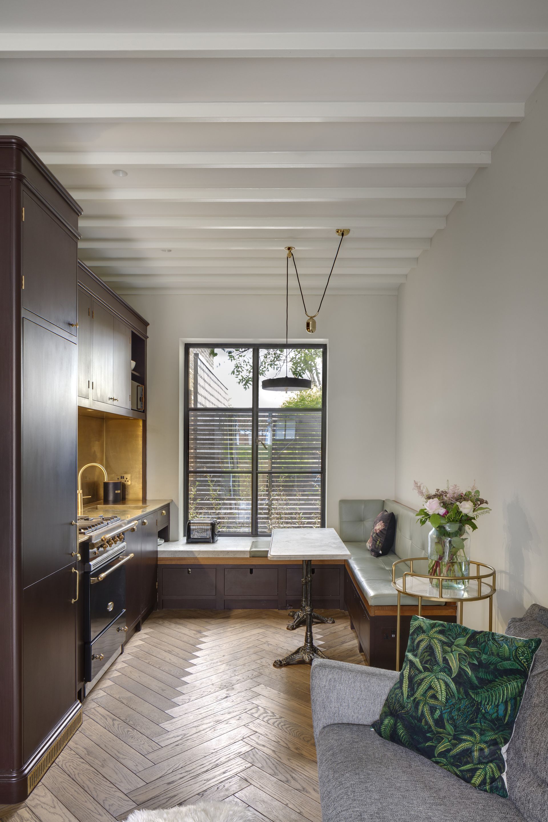 A small kitchen cum banquette area