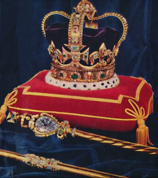 St. Edward's Crown, which Queen Elizabeth and King Charles wore at their coronations, sits on a red pillow