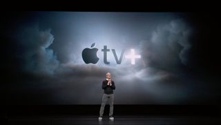 Tim Cook on stage presenting Apple TV+