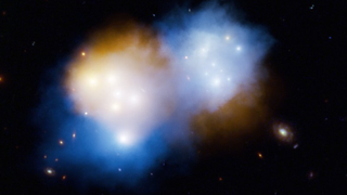 Mixing clouds of orange and blue in deep space