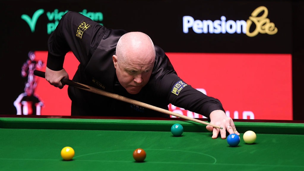 John Higgins plays a shot during the World Snooker Championship 2026