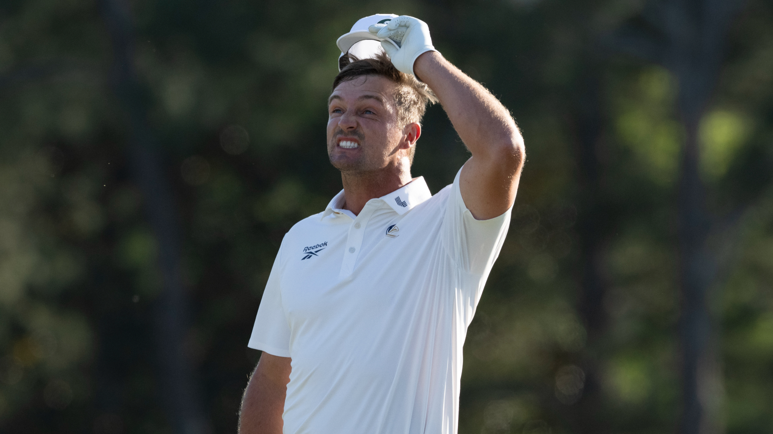 Bryson DeChambeau reacts to a putt