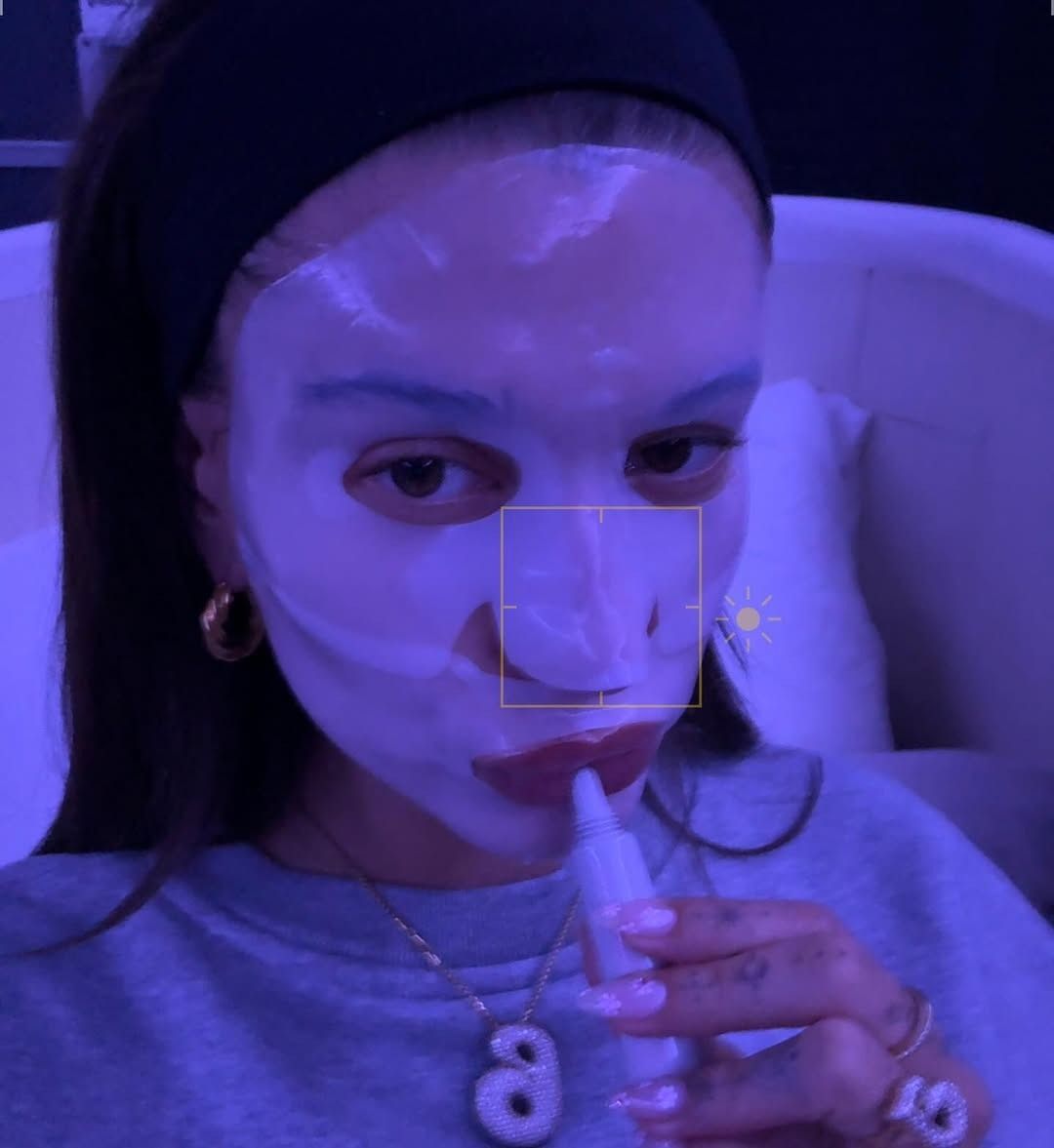 Hailey Bieber doing nighttime skincare.