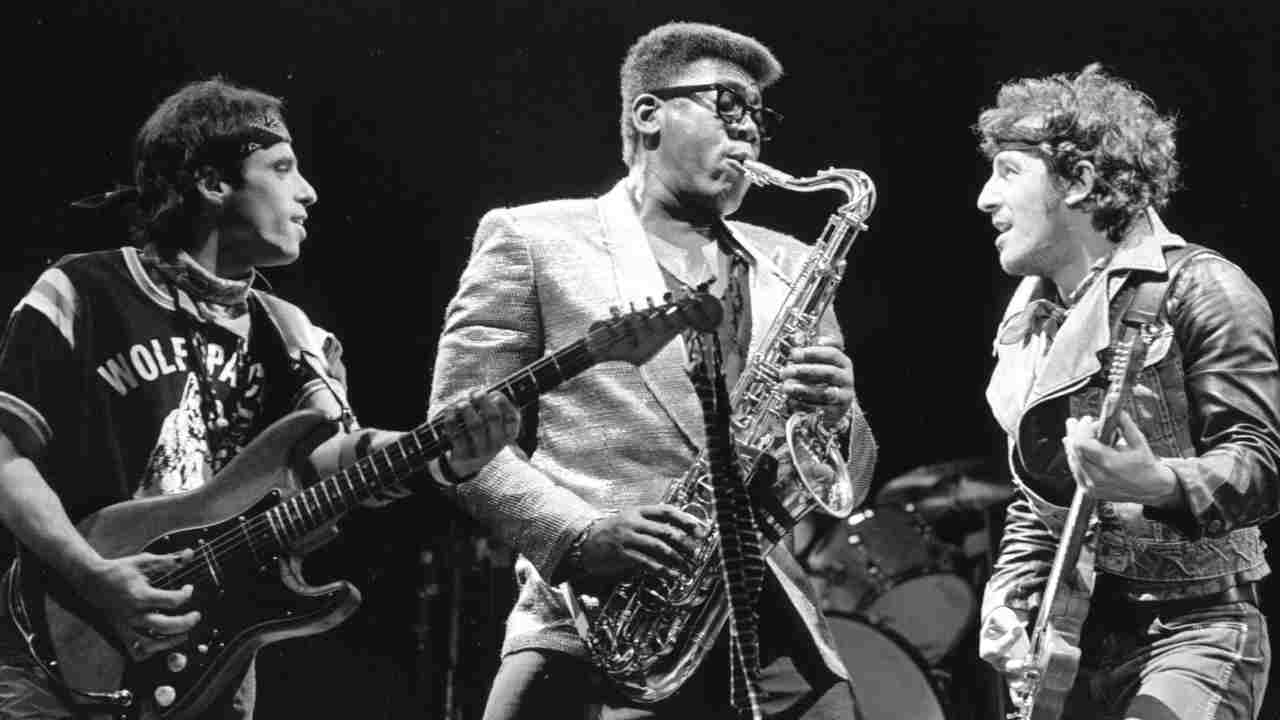 Nils Lofgren, Clarence Clemons and Bruce Springsteen performing onstage in the 1980s