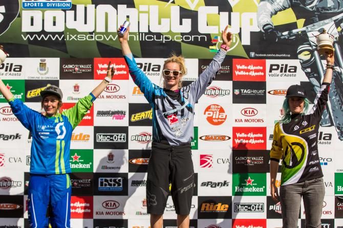 The elite women's podium at the Pila Gressen round of the iXS Downhill Cup