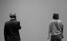 black and white pictures of people looking at white walls