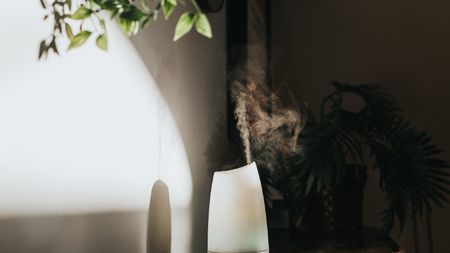 A white Oil Diffuser / Humidifier in a Domestic Setting - stock photo