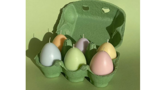 A box of six egg-shaped candles