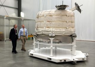 William Gerstenmaier, NASA’s associate administrator for human exploration and operations, and Jason Crusan, director of the agency's advanced exploration systems division, view the Bigelow Expandable Activity Module (BEAM) in its compressed form at Bigelow’s facility in Las Vegas on March 12, 2015. BEAM will expand to just over 13 feet (4.01 meters) long and 10.5 feet (3.23 m) wide once it is attached to the International Space Station.