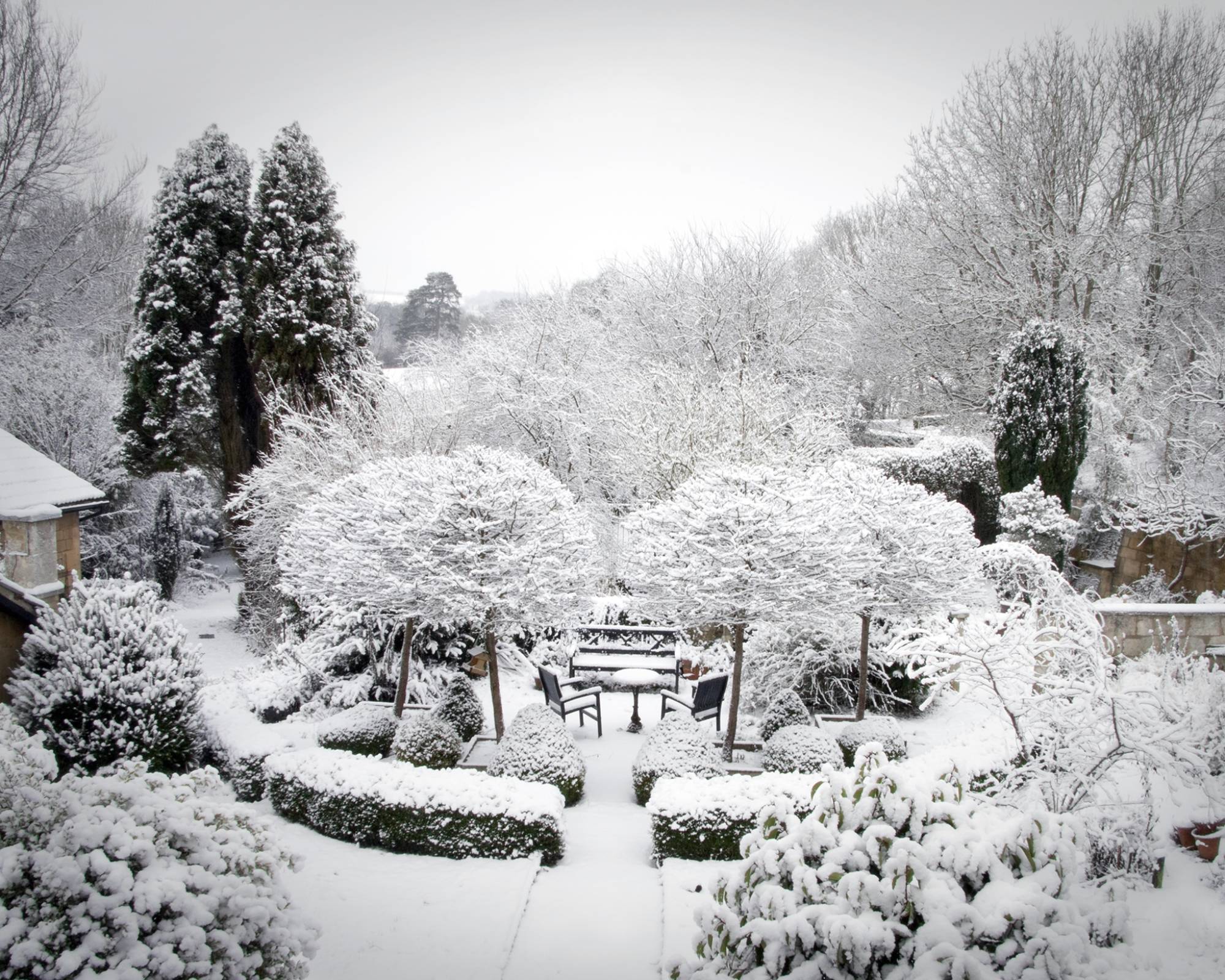 Formal garden covered in blanket of snow