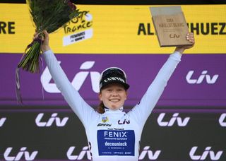 ALPE DHUEZ FRANCE AUGUST 18 Puck Pieterse of The Netherlands and Team FenixDeceuninck celebrates at podium as final White Best Young Rider Jersey winner during the 3rd Tour de France Femmes 2024 Stage 8 a 1499km stage from Le GrandBornand to Alpe dHuez 1828m UCIWWT on August 18 2024 in Alpe dHuez France Photo by Alex BroadwayGetty Images