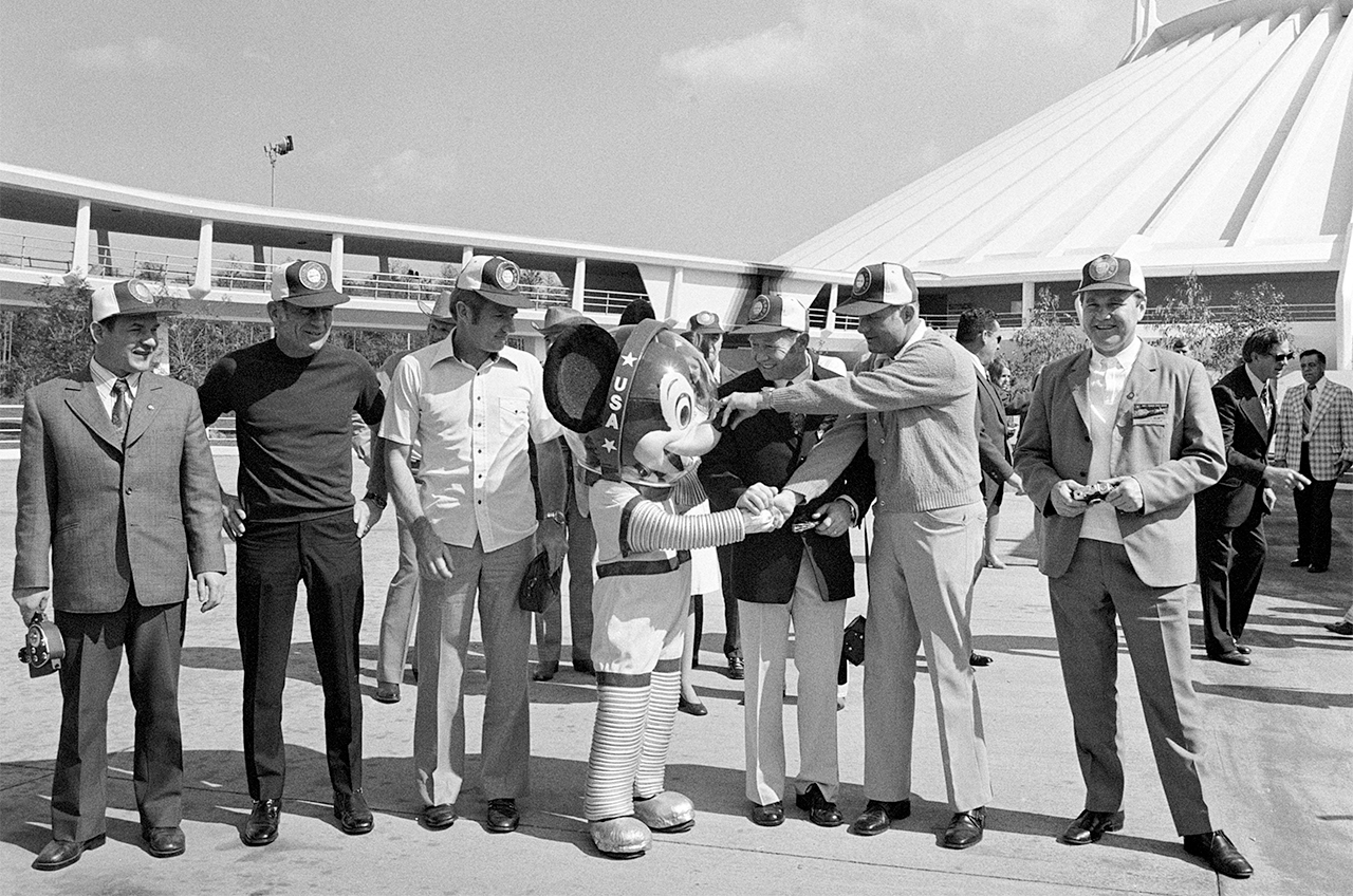 Mickey Mouse welcomes the Apollo-Soyuz Test Project crew to Florida's Disney World on Feb. 9, 1975. Meeting Mickey are, from the left, cosmonaut Valery Kubasov, astronauts Deke Slayton and Vance Brand, cosmonaut Alexei Leonov, astronaut Tom Stafford and cosmonaut Vladimir Shatalov, chief of cosmonaut training for the Soviet Union.