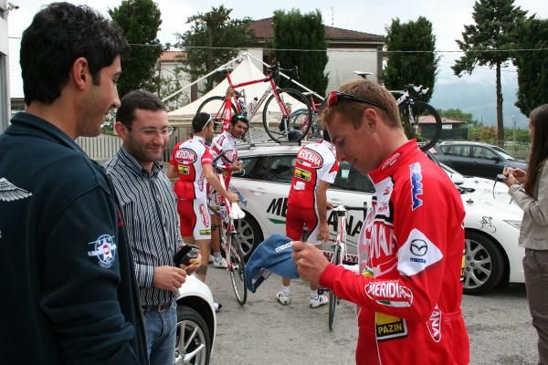 Riccardo Ricco signs a souvenir