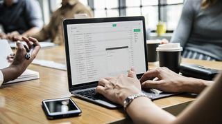 A person using email on a laptop.