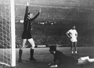 Giacinto Facchetti celebrates after scoring for Inter against Real Madrid in the European Cup in 1966.