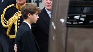 James, Viscount Severn, and Mike Tindall walk outside the Westminster Abbey