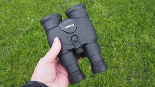 Canon 12x36 IS III binoculars held in reviewer's hand