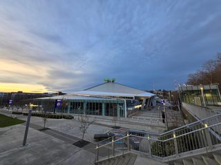 A building with a blue and yellow sunset sky