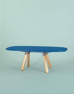 Dining table with blue top and wooden legs