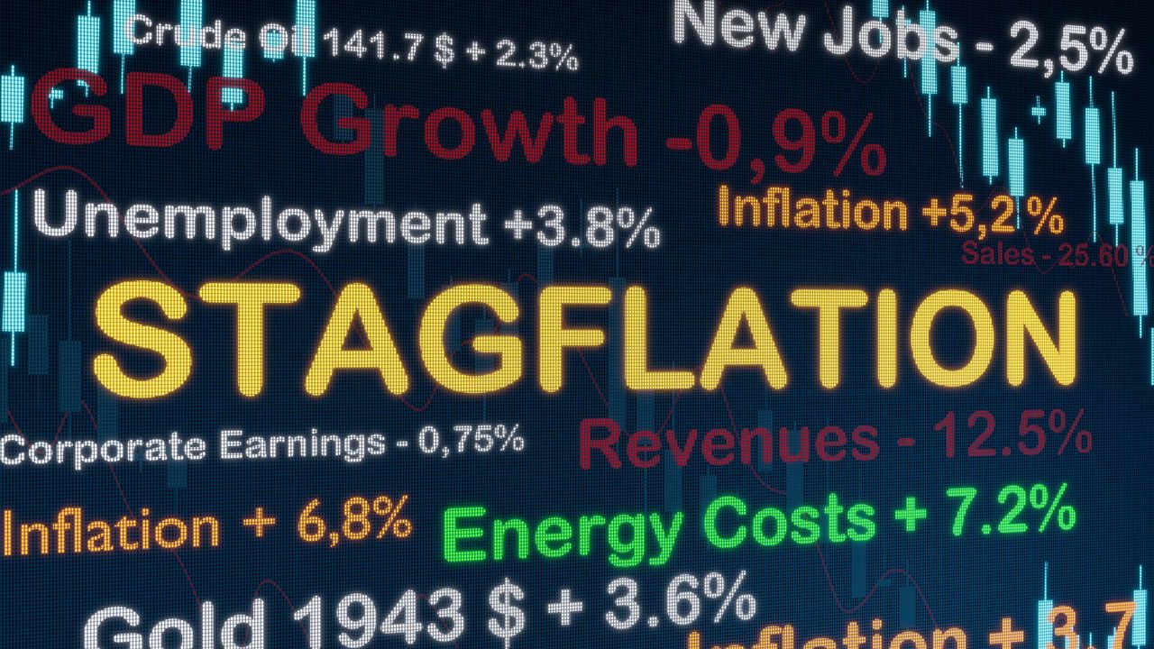 the word &quot;stagflation&quot; on a computer screen surrounded by economic data points like unemployment