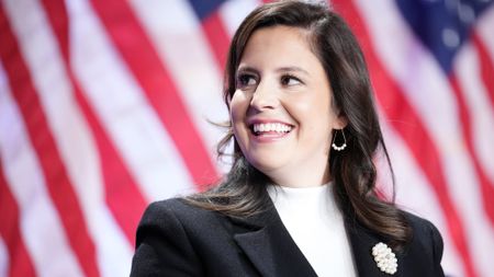 Elise Stefanik (R-NY) listens as U.S. President-elect Donald Trump speaks at the House Republicans Conference meeting at the Hyatt Regency on Capitol Hill on November 13, 2024 in Washington, DC.