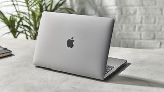 Apple MacBook Pro 13-inch (M1, 2020) opened up on a desk