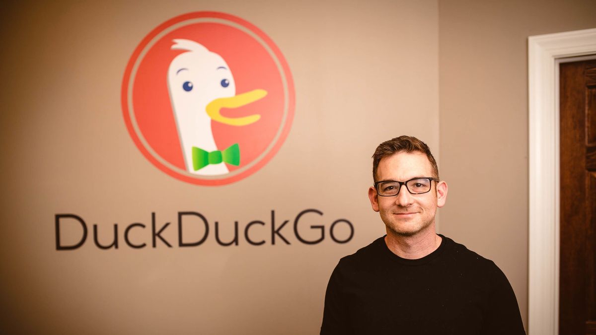 DuckDuckGo CEO Gabriel Weinberg standing in front of his company&amp;#039;s logo