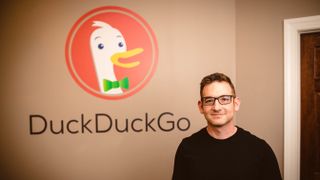DuckDuckGo CEO Gabriel Weinberg standing in front of his company