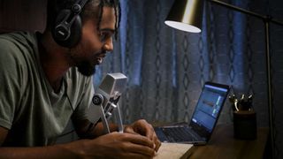 AKG Lyra lifestyle image with guy sat at desk talking into mic