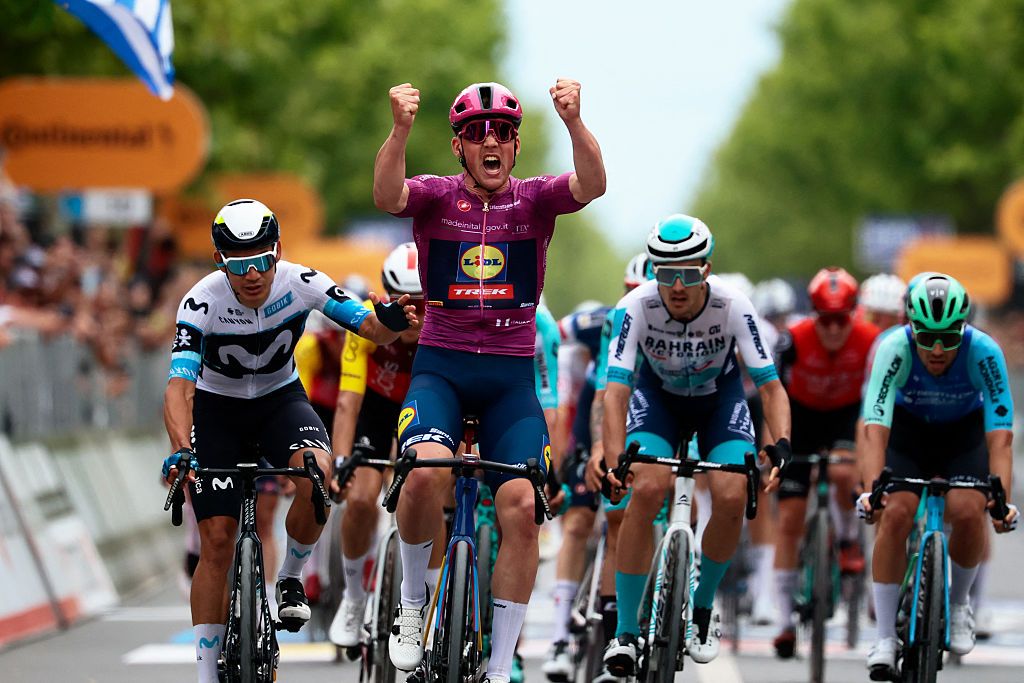 Lidl-Trek's Danish rider Mads Pedersen (C) wearing the points classification mauve jersey (Maglia Ciclamino) celebrates as he crosses the finish line to win the 3rd stage of the 108th Giro d'Italia cycling race, 160km from Vlore to Vlore in Albania, on May 11, 2025. (Photo by Luca Bettini / AFP)