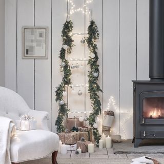 White ladder Christmas tree with garland