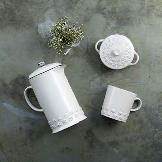 white iron casserole, mug and jar