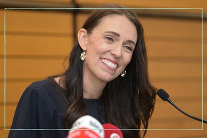 A close up of Jacinda Ardern smiling at the press conference where she announced her resignation