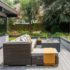 Rattan garden furniture seating area on composite decking
