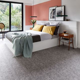bedroom with grey carpet floor and bed
