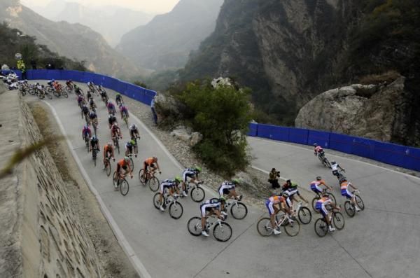 The riders descend a hairpin corner