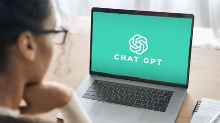 woman using ChatGPT AI on a laptop 