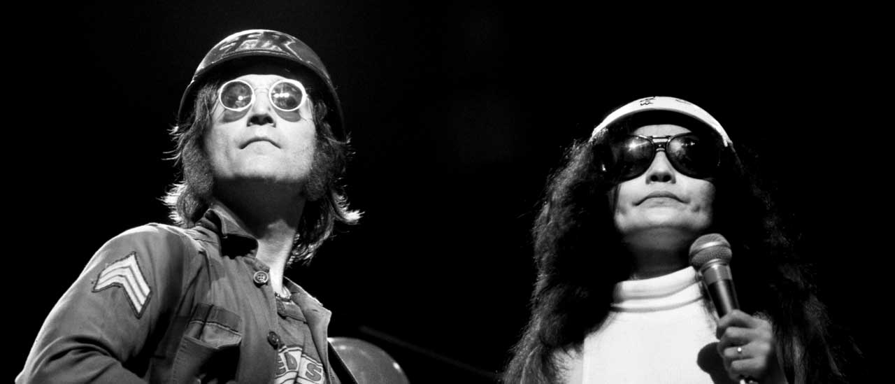 John Lennon and Yoko Ono onstage