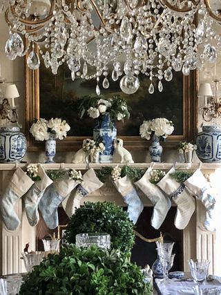 Christmas foliage ideas with stockings and fireplace