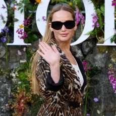Jennifer Lawrence wears a leopard print coat and sunglasses at the dior cruise 2025 show
