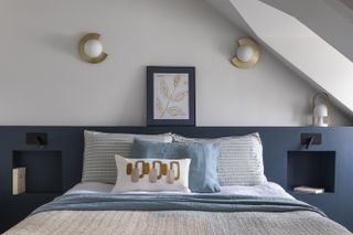 blue headboard in white bedroom