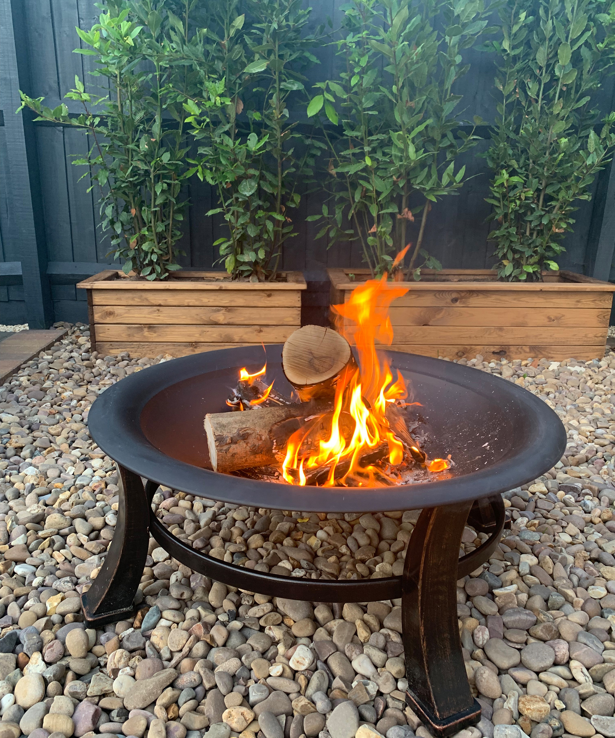 fire pit sitting on pebbles