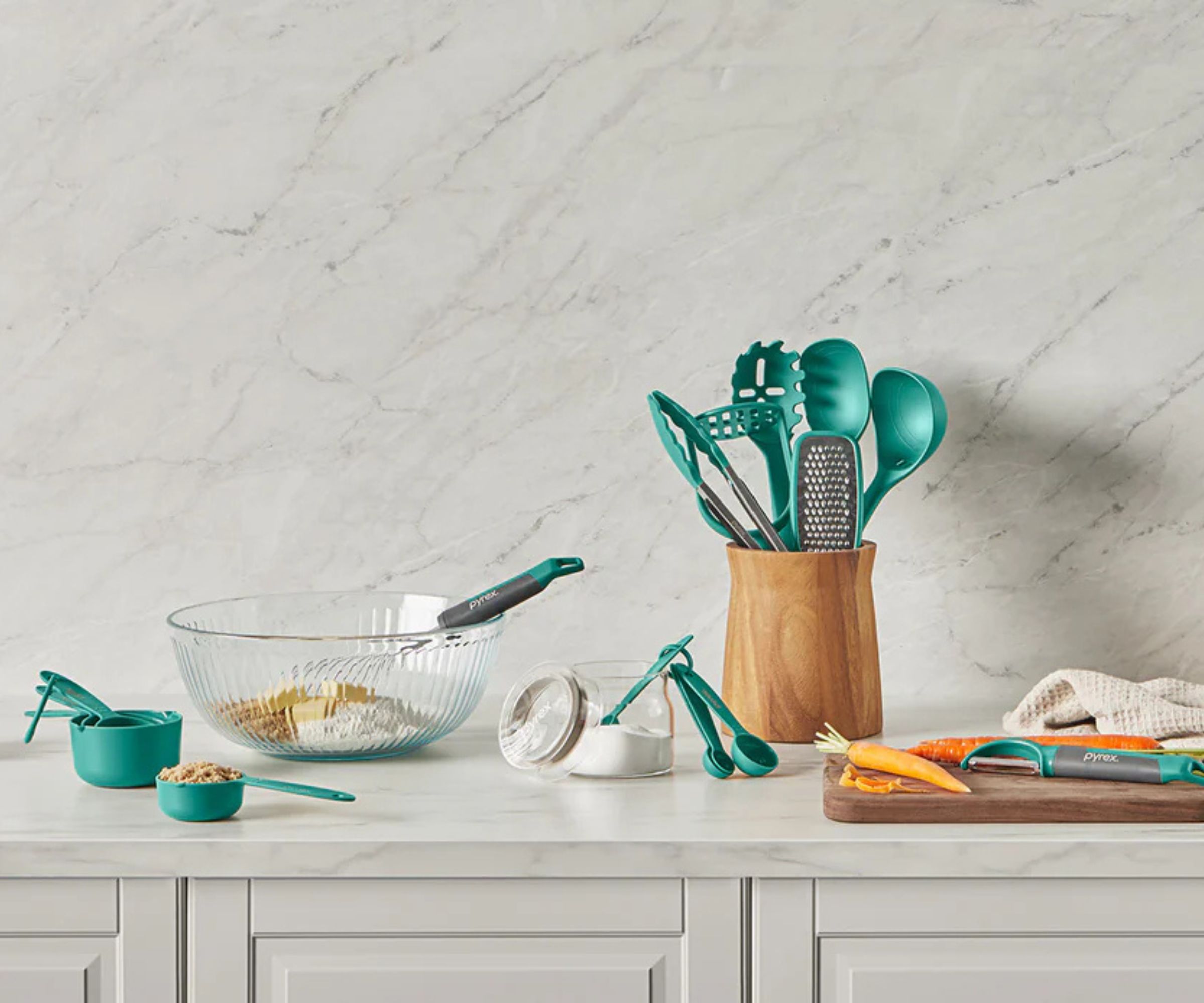 A gray kitchen with Pyrex kitchenware on the countertop