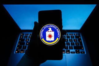 Central Intelligence Agency seal is displayed on a mobile phone screen.