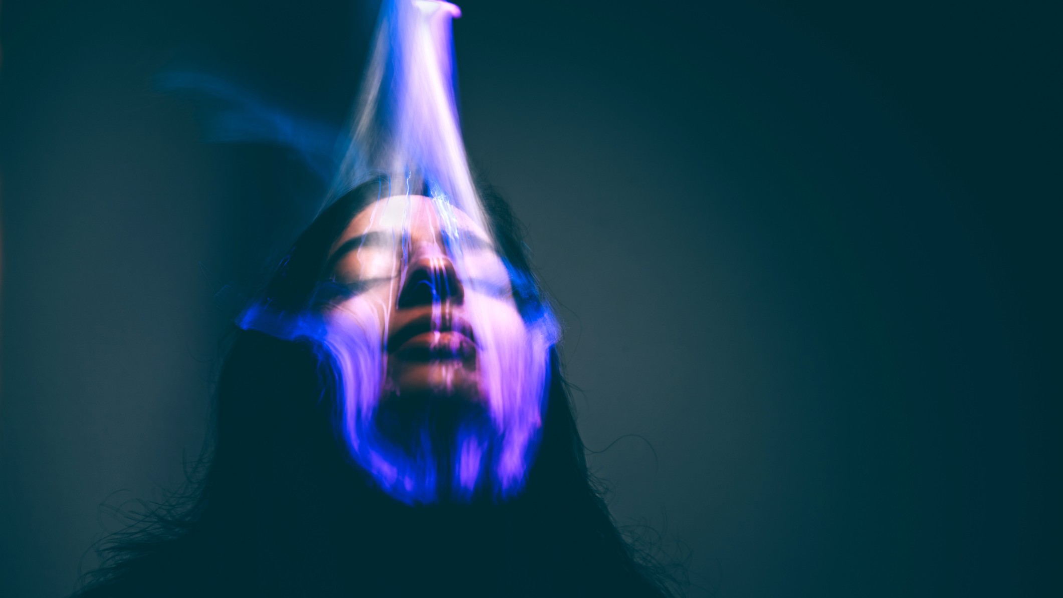 A woman's face getting scanned by a biometric identification device - stock photo