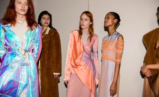 Models wear florescent jackets, teddy coats and pearl-like wrap dresses layered with mesh