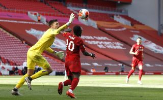 Burnley goalkeeper Nick Pope blocks a shot from Liverpool’s Sadio Mane during the Premier League match at Anfield Stadium, Liverpool
